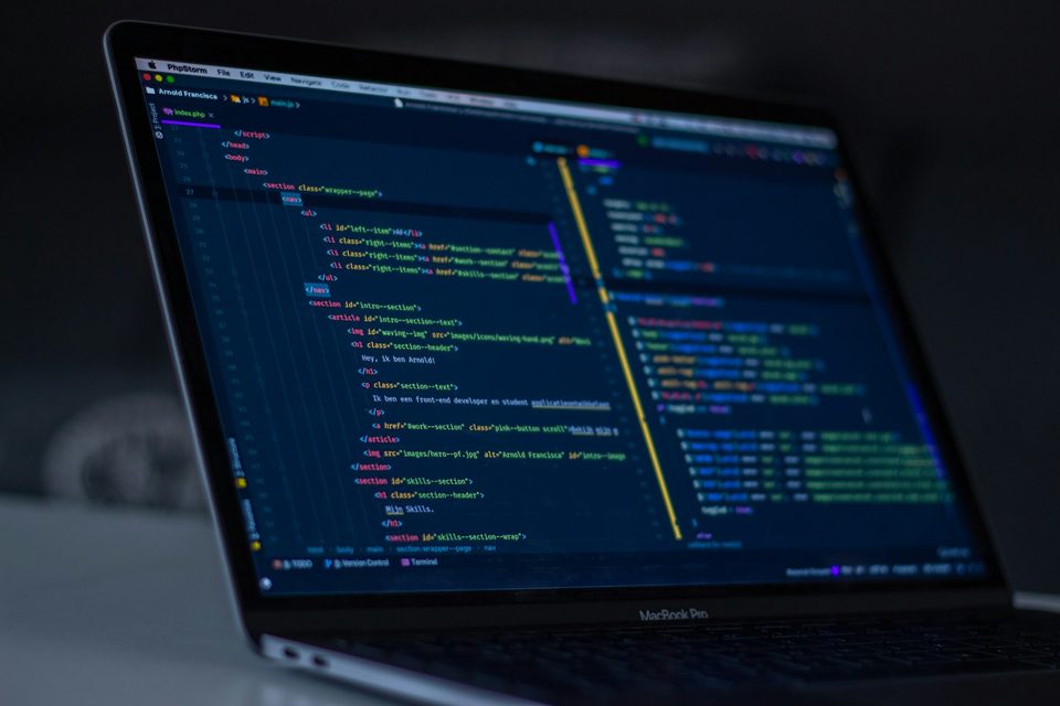 Laptop showing application source code