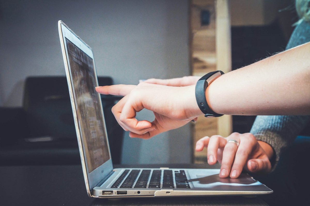 Hands at a laptop during a scoping conversation